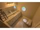 Corner bathroom with a sink and toilet at 10035 Anaheim Dr, Alpharetta, GA 30022