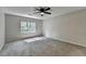 Bedroom with gray walls, carpet flooring, and natural light at 10035 Anaheim Dr, Alpharetta, GA 30022