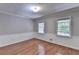 Bedroom with hardwood floors, neutral walls, and natural light at 10035 Anaheim Dr, Alpharetta, GA 30022