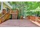 Multi-level wooden deck design with steps and latticework features at 10035 Anaheim Dr, Alpharetta, GA 30022