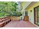 Wooden deck with access to backyard and a light yellow home exterior at 10035 Anaheim Dr, Alpharetta, GA 30022