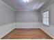 Dining room featuring hardwood floors, wainscoting, and ample natural light at 10035 Anaheim Dr, Alpharetta, GA 30022