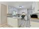 Spacious kitchen features white cabinetry, granite counters, and a full suite of stainless steel appliances at 10035 Anaheim Dr, Alpharetta, GA 30022
