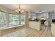 Bright breakfast nook with large windows and views of the lush backyard at 10035 Anaheim Dr, Alpharetta, GA 30022