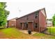A fenced backyard featuring a brick house and patio at 12275 Styron Dr, Hampton, GA 30228