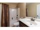 A bathroom including a shower-tub combo with a shower curtain and a single sink vanity at 12275 Styron Dr, Hampton, GA 30228