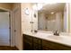 A bathroom with double vanity, a large mirror, and a shower/tub combination at 12275 Styron Dr, Hampton, GA 30228