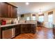 Kitchen with stainless steel appliances and breakfast nook, open to living room at 12275 Styron Dr, Hampton, GA 30228