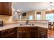 Kitchen showcasing cabinets, stainless steel sink, and breakfast nook at 12275 Styron Dr, Hampton, GA 30228