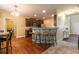 An open concept living area with a kitchen, breakfast nook, and bar seating at 12275 Styron Dr, Hampton, GA 30228