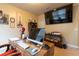 Comfortable office space with desk, large TV, and military themed decorations at 12275 Styron Dr, Hampton, GA 30228