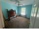 Bright bedroom featuring a ceiling fan, carpeted floor, and natural light from the window at 2295 Amberbrook Lane Ln, Grayson, GA 30017
