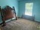 Bedroom featuring carpeted floor and natural light from the window at 2295 Amberbrook Lane Ln, Grayson, GA 30017