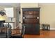 Close up of dining room hutch with decor and cabinets that match the kitchen at 2295 Amberbrook Lane Ln, Grayson, GA 30017