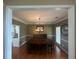 Inviting dining room with elegant chandelier, hardwood floors, and seamless flow to other rooms at 2295 Amberbrook Lane Ln, Grayson, GA 30017
