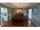 Traditional dining room featuring warm lighting and a dining set for an inviting atmosphere at 2295 Amberbrook Lane Ln, Grayson, GA 30017
