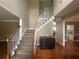 Inviting entryway with hardwood floors, staircase, and wainscoting at 2295 Amberbrook Lane Ln, Grayson, GA 30017
