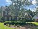 Beautiful two-story brick home with manicured landscaping and a charming front porch at 2295 Amberbrook Lane Ln, Grayson, GA 30017