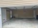 Spacious two-car garage with ample storage space and a clean concrete floor at 2295 Amberbrook Lane Ln, Grayson, GA 30017