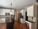 Traditional kitchen features white cabinets, dark countertops, stainless appliances, and a dark wood island at 2295 Amberbrook Lane Ln, Grayson, GA 30017