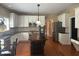 Traditional kitchen features white cabinets, dark countertops, stainless appliances, and a dark wood island at 2295 Amberbrook Lane Ln, Grayson, GA 30017