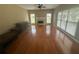 Bright living room with hardwood floors, fireplace, and ample natural light from large windows at 2295 Amberbrook Lane Ln, Grayson, GA 30017