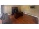 Office with beautiful wood floors, large desk, and television at 2295 Amberbrook Lane Ln, Grayson, GA 30017