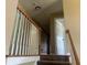 Staircase with wooden railing and carpeted steps at 2295 Amberbrook Lane Ln, Grayson, GA 30017
