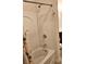 Bathroom shower with palm-patterned curtain and white fixtures at 3150 Woodwalk Se Dr # 3112, Atlanta, GA 30339