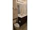 Bathroom with a dark wood vanity, white countertop, and a large mirror at 3150 Woodwalk Se Dr # 3112, Atlanta, GA 30339