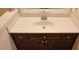 Bathroom vanity with white countertops and dark wood cabinets at 3150 Woodwalk Se Dr # 3112, Atlanta, GA 30339