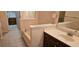 Bathroom featuring a tub and dark wood vanity with a white countertop at 3150 Woodwalk Se Dr # 3112, Atlanta, GA 30339