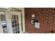 Apartment complex entryway featuring a secure access system on a brick wall at 3150 Woodwalk Se Dr # 3112, Atlanta, GA 30339