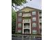 Brick building with multiple levels and balconies, complemented by lush greenery at 3150 Woodwalk Se Dr # 3112, Atlanta, GA 30339
