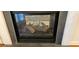Close-up of the fireplace with a gray stone surround and logs at 3150 Woodwalk Se Dr # 3112, Atlanta, GA 30339