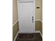 Unit 3112 features a welcoming front door with security features and a personalized door mat at 3150 Woodwalk Se Dr # 3112, Atlanta, GA 30339