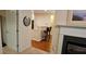 Open-concept living room with hardwood floors, granite countertops, and a decorative fireplace at 3150 Woodwalk Se Dr # 3112, Atlanta, GA 30339