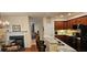 Inviting living space seamlessly connects the dining area and kitchen with a cozy fireplace at 3150 Woodwalk Se Dr # 3112, Atlanta, GA 30339