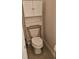 Efficient toilet with a cabinet above, maximizing space in the bathroom at 3150 Woodwalk Se Dr # 3112, Atlanta, GA 30339