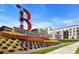 Landscaped entrance to Truist Park and The Battery Atlanta; featuring vibrant flowers and signage at 3150 Woodwalk Se Dr # 3112, Atlanta, GA 30339