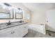 Bathroom featuring double sink vanity with granite countertop and a soaker tub at 4060 Highway 81, Hampton, GA 30228