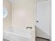 Bathroom featuring a soaker tub with matte black hardware at 4060 Highway 81, Hampton, GA 30228