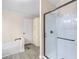 Bathroom showcasing a walk-in shower with dark trim and built-in shelving for storage at 4060 Highway 81, Hampton, GA 30228