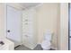 Bathroom featuring a linen closet, toilet, and a walk-in shower at 4060 Highway 81, Hampton, GA 30228