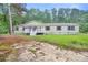 View of the front of the house showcasing the yard and the front porch at 4060 Highway 81, Hampton, GA 30228