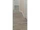Hallway features grey, wood-look flooring and white doors at 4060 Highway 81, Hampton, GA 30228