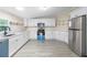 Kitchen featuring white cabinetry and stainless steel appliances with an electric oven at 4060 Highway 81, Hampton, GA 30228