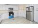 Bright kitchen features stainless steel appliances, white cabinets, and modern countertops at 4060 Highway 81, Hampton, GA 30228