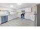 Kitchen featuring white cabinetry and appliances with a black and stainless steel oven range at 4060 Highway 81, Hampton, GA 30228