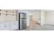 Open-concept kitchen features stainless steel refrigerator and a view into the living room at 4060 Highway 81, Hampton, GA 30228